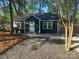 Charming blue home with a gravel front yard and inviting entrance at 1401 Anderson St, Charlotte, NC 28205