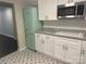 Bright kitchen with white cabinetry, stainless microwave and a retro refrigerator at 1401 Anderson St, Charlotte, NC 28205