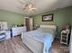 Bedroom featuring luxury vinyl plank floors and comfortable furniture with ample natural light at 14522 Waterside Dr, Charlotte, NC 28278