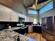 Modern kitchen with stainless appliances, granite countertops, and ample cabinet space at 14522 Waterside Dr, Charlotte, NC 28278