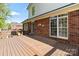 Spacious brick and wood deck with views of the home's exterior at 1511 Elkhart Cir, Gaston, NC 28054