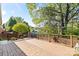 Lovely wood deck area with brick details and a spacious outdoor living space at 1511 Elkhart Cir, Gaston, NC 28054