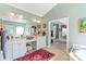 Well-lit main bathroom with double vanity, tiled floors, and a separate soaking tub at 1511 Elkhart Cir, Gaston, NC 28054