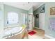 Bathroom featuring a shower, jacuzzi tub, tile floor, and a glass block window for natural light at 1511 Elkhart Cir, Gaston, NC 28054