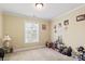 Neutral bedroom, carpeted, with a large window and ample space for relaxation or play at 1511 Elkhart Cir, Gaston, NC 28054