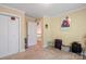 Carpeted bedroom with double door closet and access to an upstairs level with luggage and glass shelving at 1511 Elkhart Cir, Gaston, NC 28054