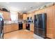 Well-equipped kitchen with wooden cabinets, modern appliances, and a functional layout at 1511 Elkhart Cir, Gaston, NC 28054