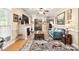 Cozy living room featuring a fireplace, hardwood floors, and ample natural light at 1511 Elkhart Cir, Gaston, NC 28054