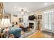 Comfortable living room featuring a fireplace, hardwood floors, and ample natural light at 1511 Elkhart Cir, Gaston, NC 28054