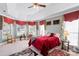 Spacious main bedroom with tray ceiling, sitting area, and large windows for ample natural light at 1511 Elkhart Cir, Gaston, NC 28054
