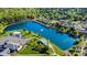 Aerial view of a lakeside community with a fountain, walking trails, a recreation center, and townhouses with parking at 158 Water Oak Dr, Pineville, NC 28134
