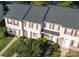Aerial shot showcasing a well-maintained townhome complex with neat landscaping and gray roofs at 158 Water Oak Dr, Pineville, NC 28134