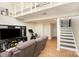 Spacious finished basement area with a cozy seating area, stairs, and ample space for activities at 158 Water Oak Dr, Pineville, NC 28134