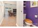 Charming powder room features colorful walls and decorative shelves at 158 Water Oak Dr, Pineville, NC 28134