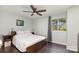 Bedroom with hardwood floors and a window, a ceiling fan and a bed with white linens at 158 Water Oak Dr, Pineville, NC 28134