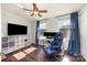 Bedroom featuring hardwood floors, a ceiling fan and two windows at 158 Water Oak Dr, Pineville, NC 28134
