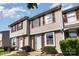 Inviting townhouse featuring light siding, a well-maintained lawn, and a welcoming front door at 158 Water Oak Dr, Pineville, NC 28134