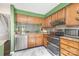 Well-equipped kitchen boasts stainless steel appliances, granite countertops, and warm wood cabinetry at 158 Water Oak Dr, Pineville, NC 28134
