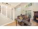 Inviting living room with a fireplace, comfortable seating, and a sliding glass door for natural light at 158 Water Oak Dr, Pineville, NC 28134