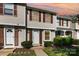 Charming townhome with neutral siding, dark shutters, and well-manicured front lawn at 158 Water Oak Dr, Pineville, NC 28134