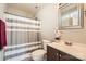 Bathroom featuring a shower with striped curtain, vanity and mirror at 1807 Oakdale Green Dr, Charlotte, NC 28216