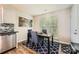 Cozy dining area with natural light and modern decor next to the kitchen at 1807 Oakdale Green Dr, Charlotte, NC 28216