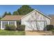 Charming single-story home with well-maintained landscaping and a two-car garage at 1807 Oakdale Green Dr, Charlotte, NC 28216