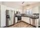 Modern kitchen featuring stainless steel appliances, white cabinetry, and a stylish backsplash at 1807 Oakdale Green Dr, Charlotte, NC 28216
