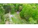 Lovely aerial view of a home surrounded by lush greenery at 181 Canipe Rd, Dallas, NC 28034