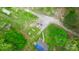 Aerial view featuring a driveway, home, and lush greenery at 181 Canipe Rd, Dallas, NC 28034