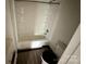 Bathroom featuring a combined shower and tub, tile surround and wood look floors at 181 Canipe Rd, Dallas, NC 28034