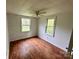 Bright bedroom features wood-look floors, neutral walls and an overhead fan at 181 Canipe Rd, Dallas, NC 28034