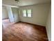 Bedroom with wood-look floors, natural light, and neutral walls at 181 Canipe Rd, Dallas, NC 28034