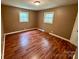 Cozy bedroom with wood-look flooring and neutral colored walls at 181 Canipe Rd, Dallas, NC 28034