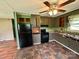 View of the kitchen with black appliances and lots of storage cabinets at 181 Canipe Rd, Dallas, NC 28034