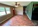 Inviting living room featuring wood-look flooring, neutral walls, and a ceiling fan at 181 Canipe Rd, Dallas, NC 28034