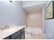 Bathroom features modern vanity, neutral walls, and shower-tub combo at 1811 Robbins Meadows Dr, Waxhaw, NC 28173