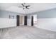 Bedroom featuring gray carpet and a ceiling fan, with a bathroom entrance at 1811 Robbins Meadows Dr, Waxhaw, NC 28173