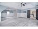 Spacious bedroom featuring a ceiling fan, half-wall accent, and cozy carpeting at 1811 Robbins Meadows Dr, Waxhaw, NC 28173