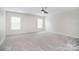 Spacious bedroom with two windows offering plenty of natural light at 1811 Robbins Meadows Dr, Waxhaw, NC 28173