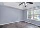 Bedroom with view to pool, ceiling fan and tray ceiling at 1811 Robbins Meadows Dr, Waxhaw, NC 28173