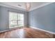 Cozy room with hardwood floors, and a large window offering bright natural light at 1811 Robbins Meadows Dr, Waxhaw, NC 28173