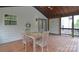 Inviting covered patio with dining table and ceiling fan at 1811 Robbins Meadows Dr, Waxhaw, NC 28173