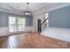 Bright dining room with hardwood floors, large window and detailed wall trim, perfect for Gathering gatherings at 1811 Robbins Meadows Dr, Waxhaw, NC 28173