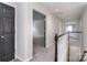 Upstairs hallway with carpet and wood railings, leading to bedrooms and other living spaces at 1811 Robbins Meadows Dr, Waxhaw, NC 28173