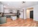Contemporary kitchen with hardwood floors, granite countertops, stainless steel appliances, and ample cabinet space at 1811 Robbins Meadows Dr, Waxhaw, NC 28173