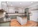 Open concept kitchen with stainless appliances, granite countertops, and modern cabinetry, perfect for the home chef at 1811 Robbins Meadows Dr, Waxhaw, NC 28173