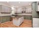 Modern kitchen with granite countertops, stainless steel appliances and a kitchen island at 1811 Robbins Meadows Dr, Waxhaw, NC 28173