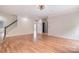 Bright and airy living room featuring wood floors, neutral walls, and stairway access at 1811 Robbins Meadows Dr, Waxhaw, NC 28173