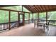 Spacious screened-in porch featuring a wood ceiling, fan, and ample space for outdoor enjoyment at 1811 Robbins Meadows Dr, Waxhaw, NC 28173